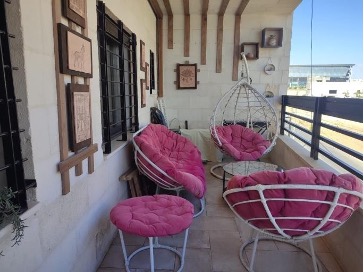 Seating spaces on a shaded balcony